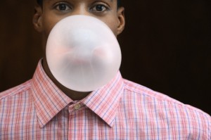 Man Blowing Chewing Gum Bubble