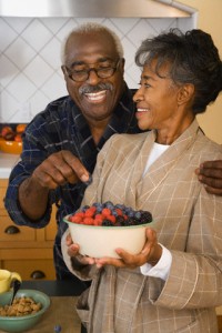 Senior couple eating fruit