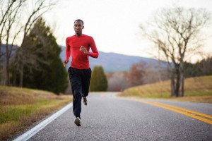A young man runs down a country road near Cheaha State Park