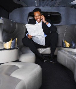 African American businessman reading newspaper