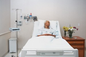 Senior woman laying in hospital bed