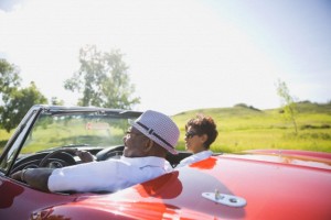 Couple enjoying road trip in convertible