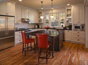 Custom residential kitchen with hardwood floors and stainless appliances