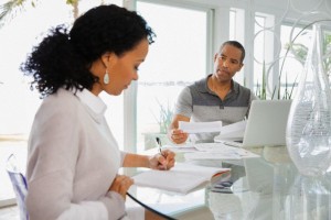 Couple working on finances at home