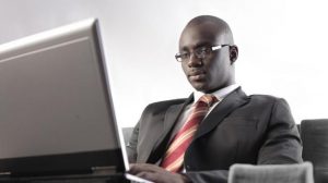 000-black-man-types-on-laptop