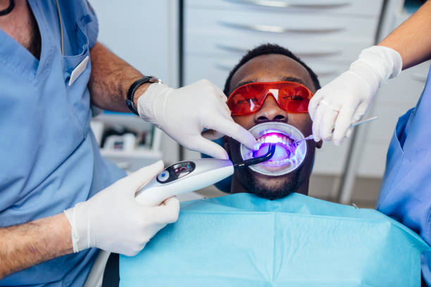 Veneers In Turkey - Black Man - At Dentist.